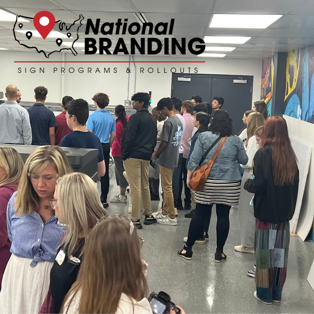 Group of Michigan high school students in a sign manufacturing facility